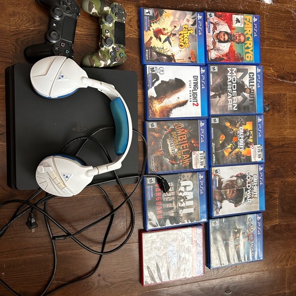 PlayStation 4 Slim (1TB) w/ 10 games two controllers and a Bluetooth headphone